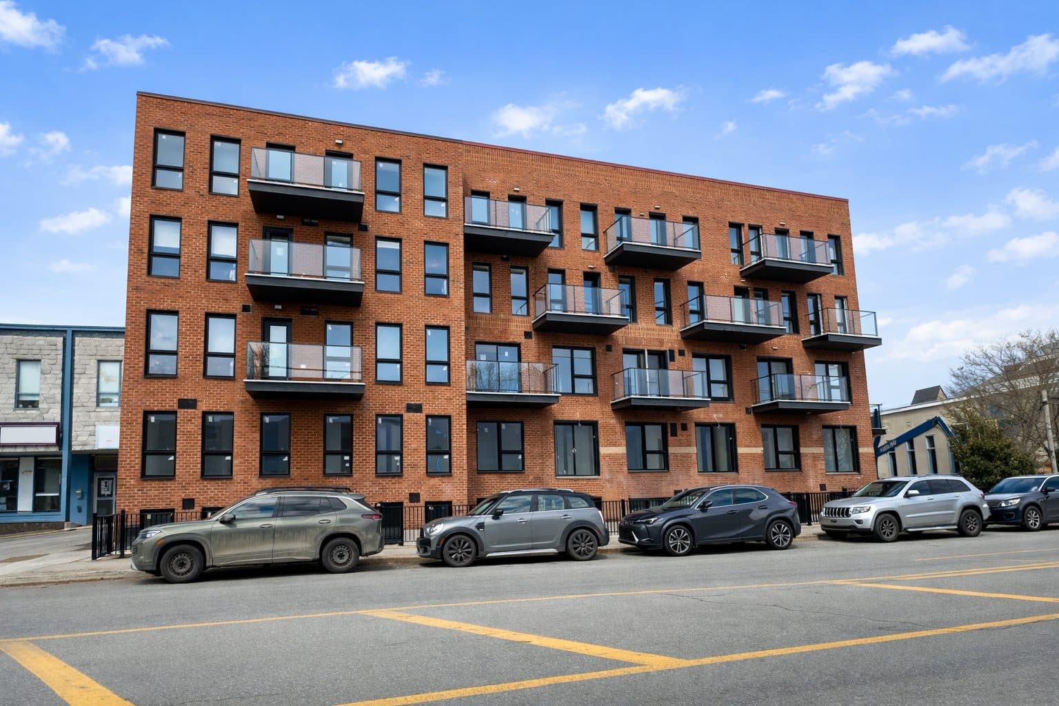 Le Sommet Somerled, a brick apartment building managed by Apex